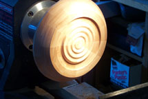 A segmented bowl gets its base adorned